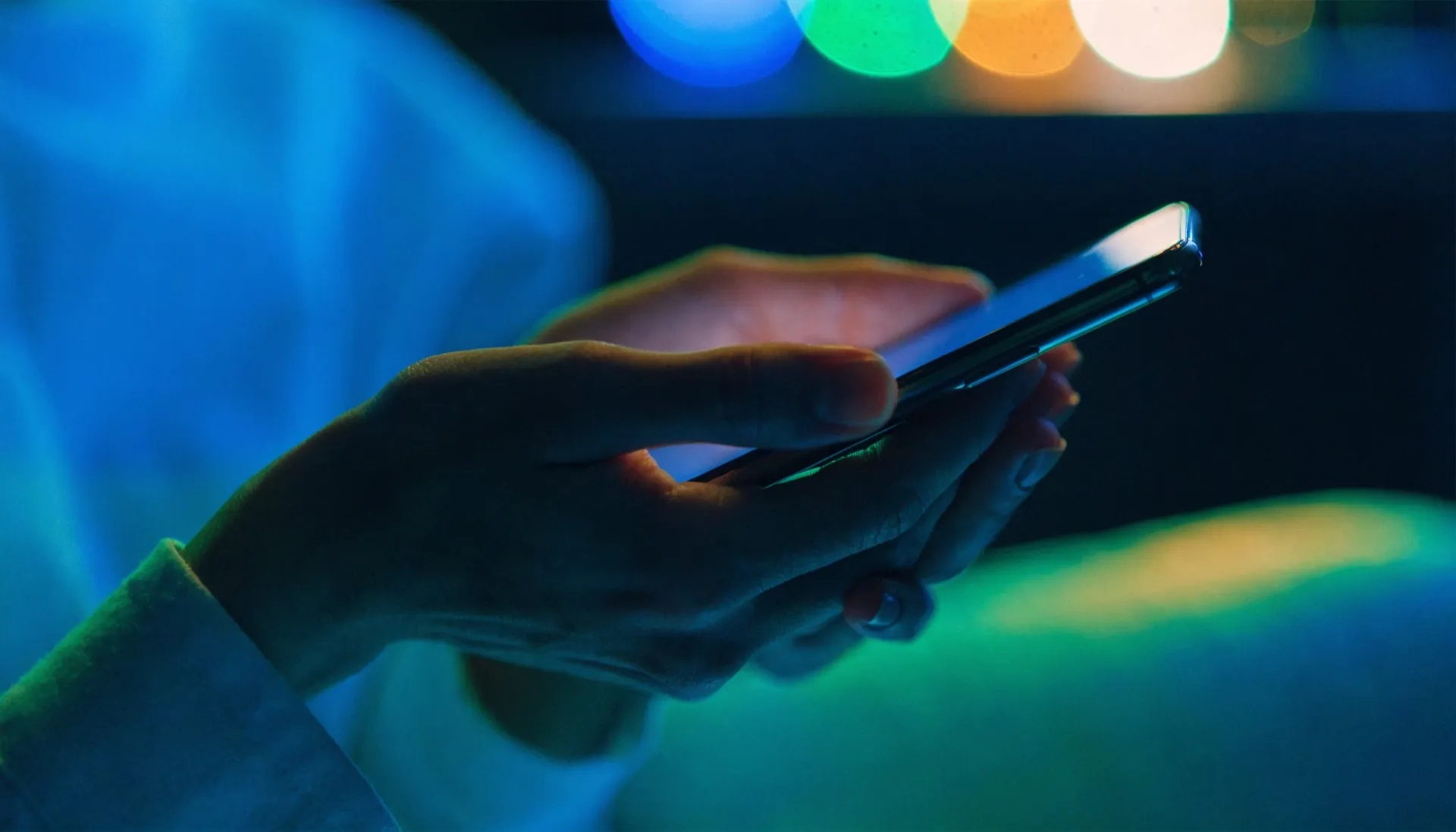 Parent checking the Edkin app on a phone at night